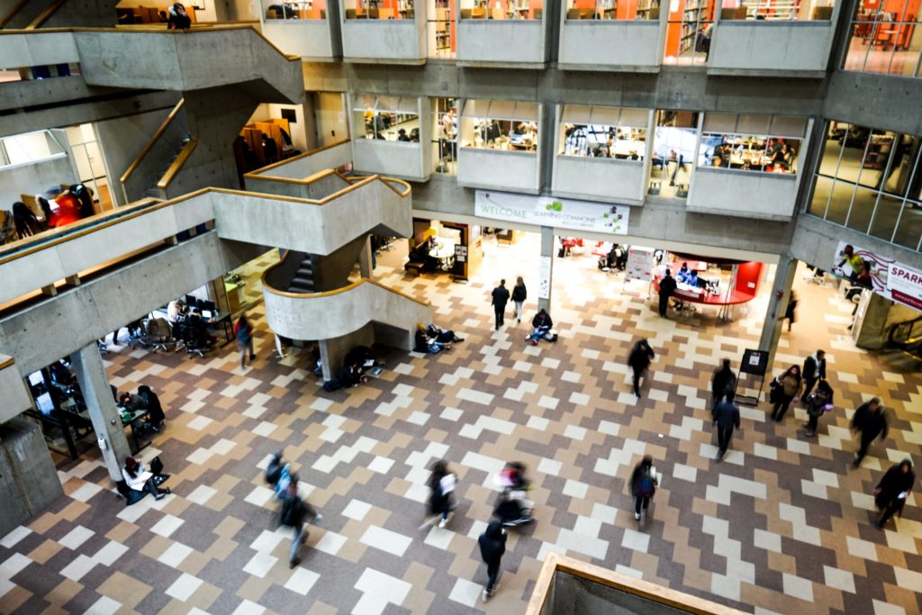 Group of students in motion in the library
